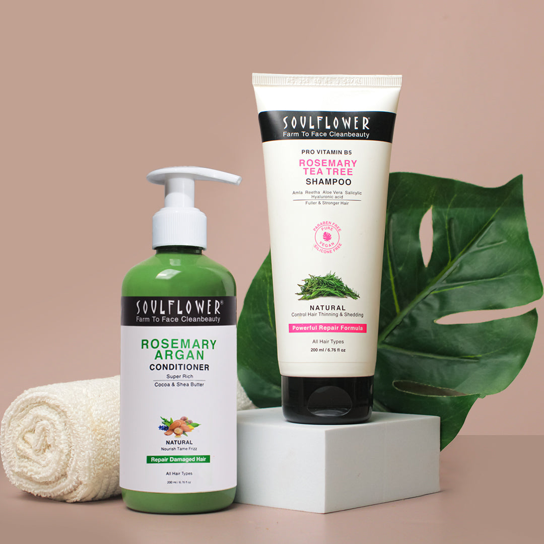  Soulflower Rosemary Argan Conditioner and Rosemary Tea Tree Shampoo for hair growth and reducing hair frizz, with the products displayed alongside a towel and a leaf.