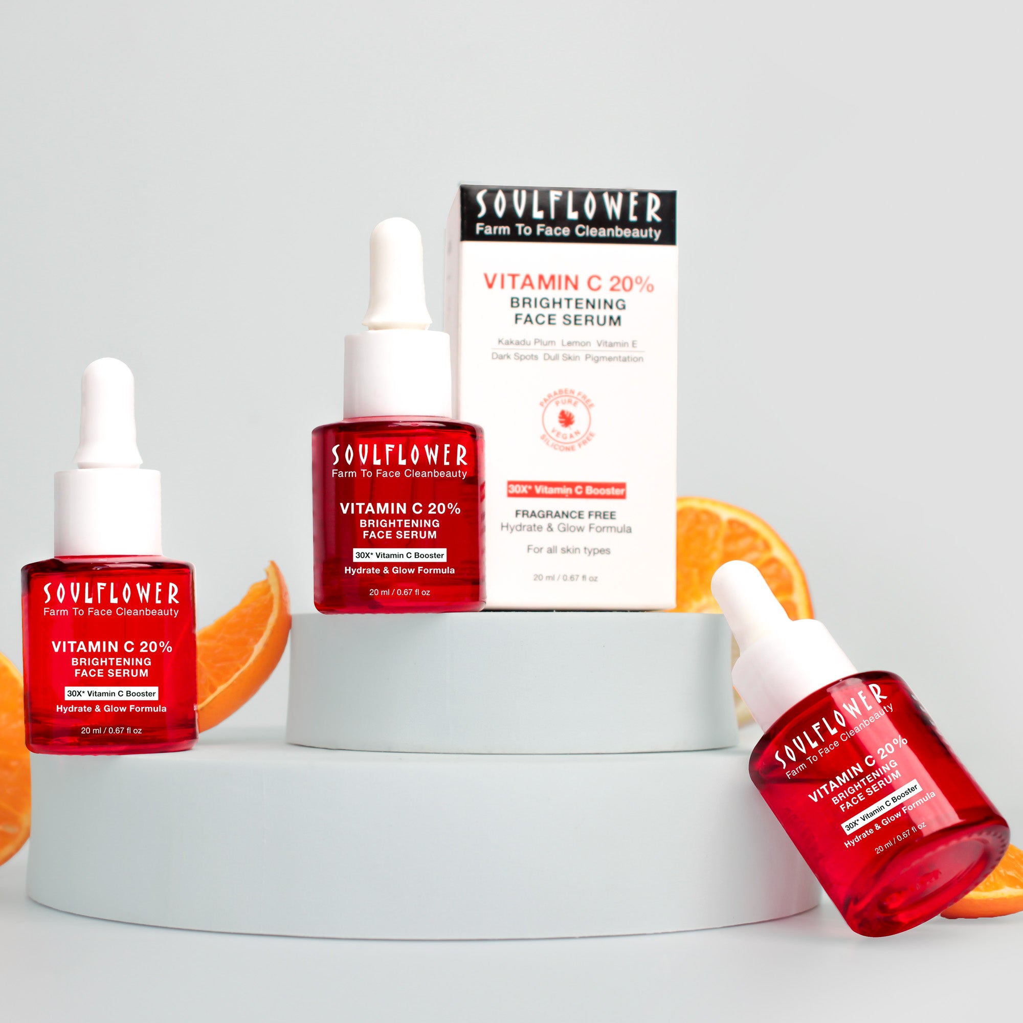 Image of Vitamin C 20% brightening serum for face alongside oranges 